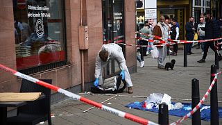 FILE --Forensics work at the scene where a man died after being stopped by police in Mannheim, Germany, Monday, May 2, 2022.