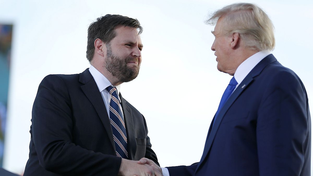 Senate candidate JD Vance, left, greets former President Donald Trump at a rally at the Delaware County Fairground, April 23, 2022, in Delaware, Ohio.