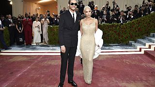 Kim Kardashian, right, wears a 1962 gown created for Marilyn Monroe at the Metropolitan Museum of Art's Costume Institute benefit gala on Monday