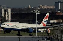 A plane lands at Heathrow Airport in London.