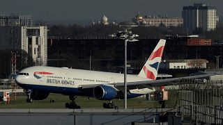 A plane lands at Heathrow Airport in London.