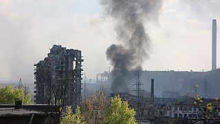 Smoke rises from the Metallurgical Combine Azovstal in Mariupol, in territory under the government of the Donetsk People's Republic, eastern Ukraine, Wednesday, May 4, 2022.