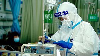 A medical worker checks records in the emergency room at the Minhang Hospital affiliated to Fudan University in Shanghai, Wednesday, April 20, 2022. 