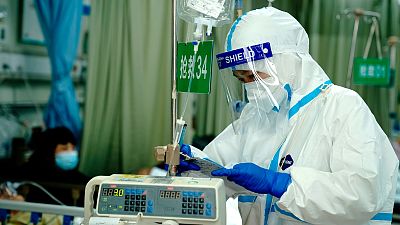 A medical worker checks records in the emergency room at the Minhang Hospital affiliated to Fudan University in Shanghai, Wednesday, April 20, 2022.