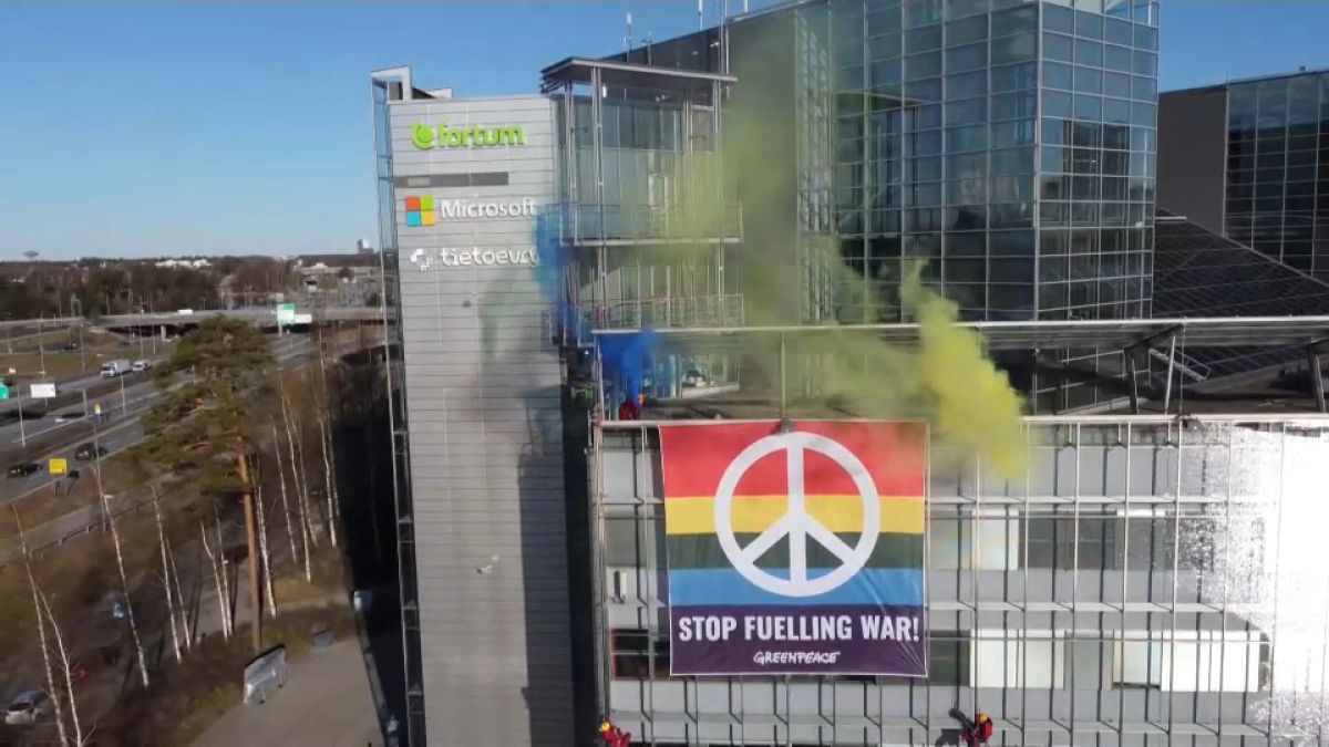 Greenpeace activists hang anti-war banner on power firm Fortum`s HQ