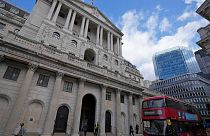 A bus drives past the Bank of England before the release of the Monetary Policy Report at the Bank of England in London, Thursday, May 5, 2022.