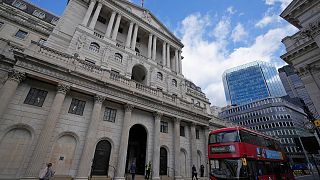 A bus drives past the Bank of England before the release of the Monetary Policy Report at the Bank of England in London, Thursday, May 5, 2022.