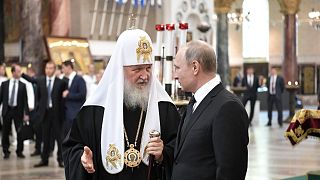 Russian President Vladimir Putin (R) and Russian Orthodox Patriarch Kirill in the Naval Cathedral in Kronshtadt, July 30, 2017.