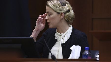 Actor Amber Heard testifies in the courtroom at the Fairfax County Circuit Court.