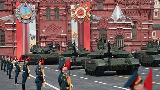 Russian T-90M and T-14 Armata tanks parade through Red Square during the general rehearsal of the Victory Day military parade.
