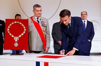 Emmanuel Macron signs the protocol at the Elysée presidential palace, during his investiture ceremony as French President.