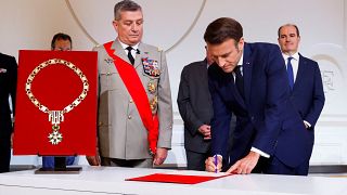 Emmanuel Macron signs the protocol at the Elysée presidential palace, during his investiture ceremony as French President.