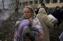 Marianna Vishegirskaya stands outside a maternity hospital that was damaged by shelling in Mariupol, Ukraine, Wednesday, March 9, 2022.