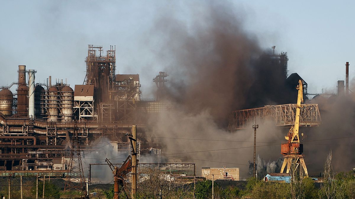 Smoke rises from the Metallurgical Combine Azovstal in Mariupol during shelling, in Mariupol, in territory under control of the Donetsk People's Republic. May 7, 2022