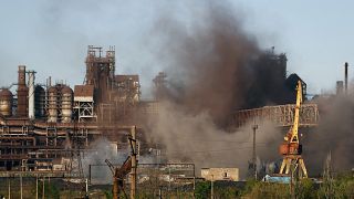 Smoke rises from the Metallurgical Combine Azovstal in Mariupol during shelling, in Mariupol, in territory under control of the Donetsk People's Republic. May 7, 2022