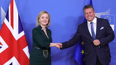 uropean Commissioner for Inter-institutional Relations and Foresight Maros Sefcovic, right, greets British Foreign Secretary Liz Truss,  in Brussels, Monday, Feb. 21, 2022.