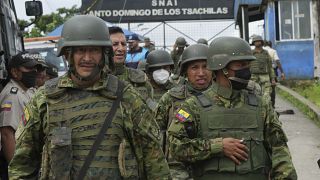 Soldiers guard outside Bellavista prison where a deadly riot broke out overnight in Santo Domingo de los Tsachilas, Ecuador, Monday, May 9, 2022. 