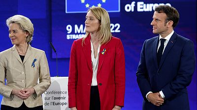 President of the European Commission, Ursula Von der Leyen, left, French president Emmanuel Macron, right, and European Parliament President Roberta Metsola, May 9, 2022.