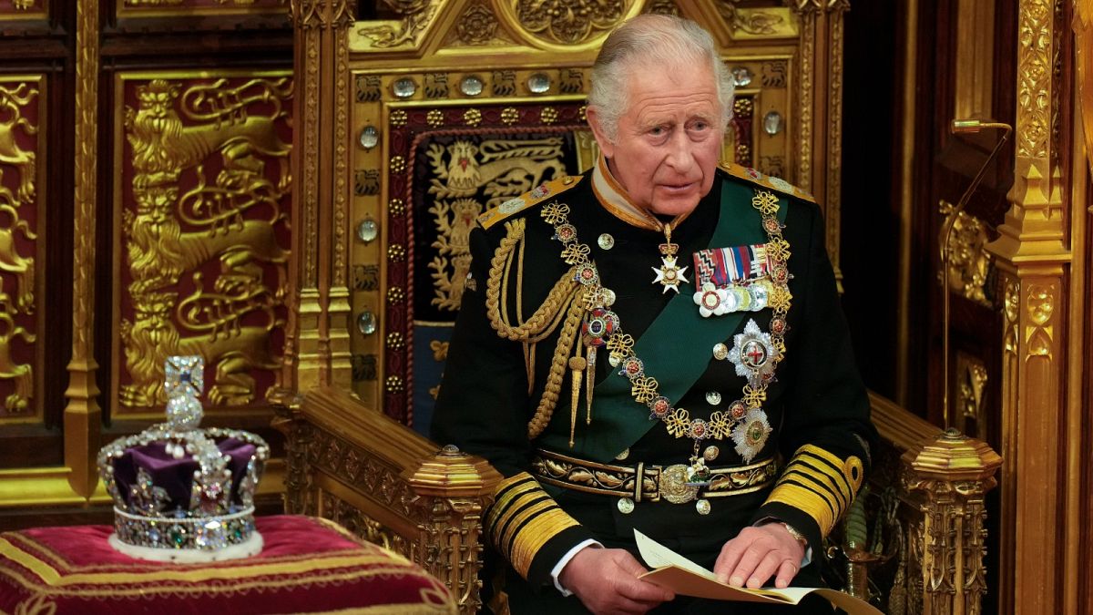 Prince Charles reads the Queen's speech next to her crown during the State Opening of Parliament, at the Palace of Westminster in London, Tuesday, May 10, 2022.