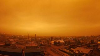 Smoke from forest fires is see over small town of Kysyl-Syr, Vilyuysky District, Sakha Republic also known as Yakutia, Russia Far East, 2021.