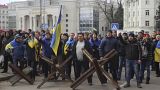 People shout toward Russian army soldiers during a rally against the Russian occupation in Svobody (Freedom) Square in Kherson, Ukraine, Monday, March 7, 2022 People shout toward Russian army soldiers during a rally against the Russian occupation in Svobody (Freedom) Square in Kherson, Ukraine, Monday, March 7, 2022