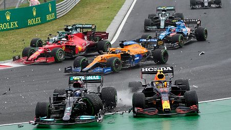 Valtteri Bottas and Sergio Perez clash in an F1 race in 2021