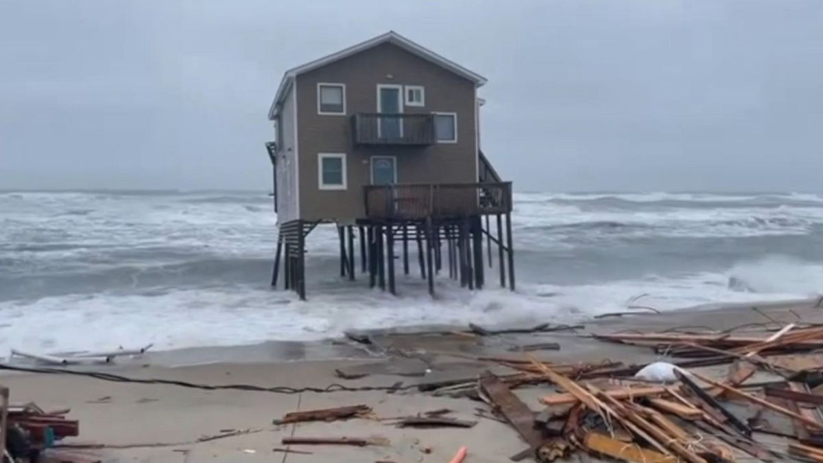 North Carolina beach house collapse into ocean during severe coastla flooding, May, 10, 2022.