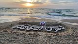 Name of slain Al Jazeera journalist carved on beach in Gaza