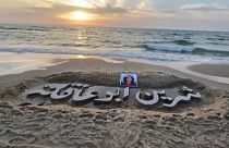 Name of slain Al Jazeera journalist carved on beach in Gaza