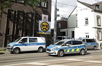 Police vehicles are parked in front of the Don Bosco High School in Essen.