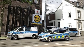 Police vehicles are parked in front of the Don Bosco High School in Essen.