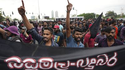 Sri Lankan undergraduates shout slogans demanding president Gotabaya Rajapaksa's resignation during a protest near parliament in Colombo, Sri Lanka