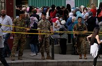 People line up to vote during parliamentary elections in Beirut, Lebanon Sunday, May 15, 2022.