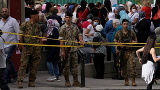 People line up to vote during parliamentary elections in Beirut, Lebanon Sunday, May 15, 2022.