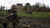 Украинские военные в возвращенном под контроль Украины селе