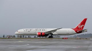 A Virgin Atlantic Airways plane taxis along the runway.