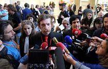 Eagles of Death Metal singer Jesse Hughes and guitarist Eden Galindo spoke to reporters on Tuesday.