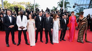 Jury members Joachim Trier, from left, Jeff Nichols, Noomi Rapace, jury president Vincent Lindon, jury members Jasmine Trinca, Asghar Farhadi, Rebecca Hall, Ladj Ly, and Deepi