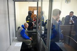 Russian army Sergeant Vadim Shishimarin, 21, is seen behind a glass during a court hearing in Kyiv, Ukraine, Friday, May 13, 2022. 