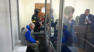 Russian army Sergeant Vadim Shishimarin, 21, is seen behind a glass during a court hearing in Kyiv, Ukraine, Friday, May 13, 2022. 