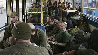 Ukrainian servicemen sit in a bus after they were evacuated from the besieged Mariupol's Azovstal steel plant. Tuesday, May 17, 2022.