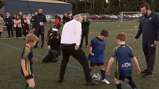  Australian Prime Minister Scott Morrison barrelled into a young boy during a friendly kick around, eliciting a chorus of stunned "ooohs" and "aaaws" from spectators.