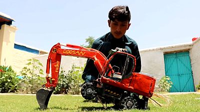 Middle school student in Afghanistan makes model vehicles from waste