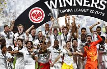 Frankfurt players lift the trophy for winners of the Europa League final soccer match between Eintracht Frankfurt and Rangers FC at the Ramon Sanchez Pizjuan stadium in Spain.