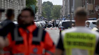 Police and emergency forces stand near a school in Bremerhaven, Germany, Thursday, May 19, 2022.