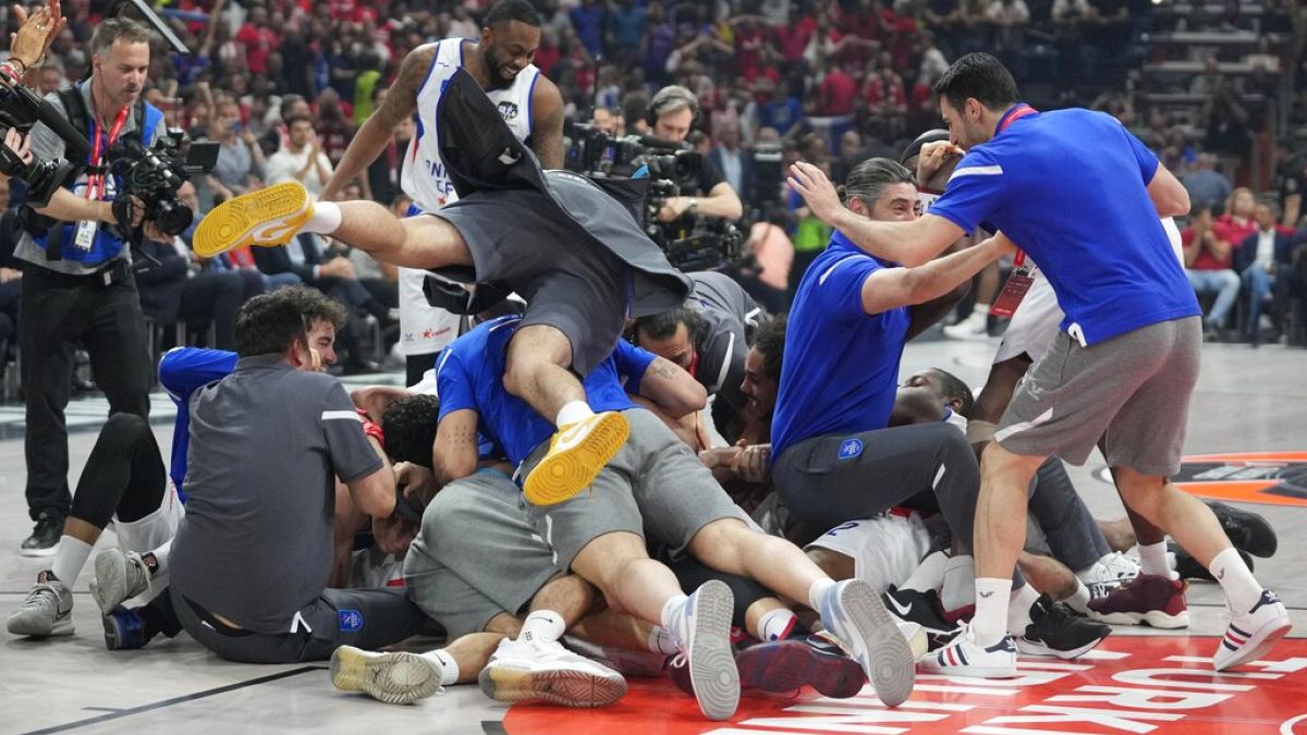 Anadolu Efes' players celebrate at the end of a Final Four Euroleague semifinal basketball match between Olympiacos and Anadolu Efes, in Belgrade.
