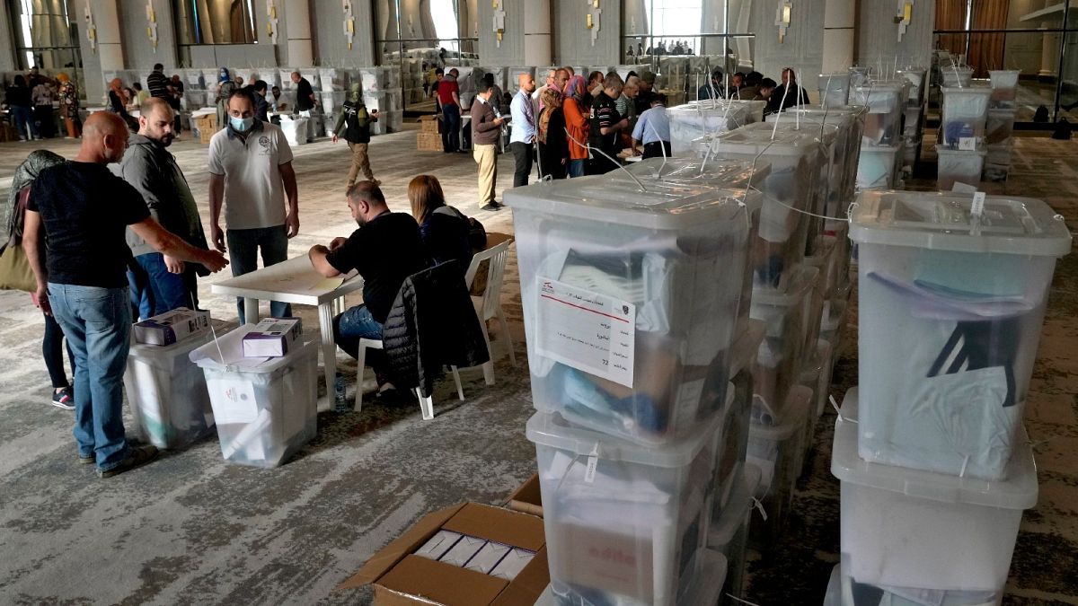 Heads of polling stations and clerks receive ballot boxes for Sunday's parliamentarian elections in Beirut, Lebanon, May 14, 2022.