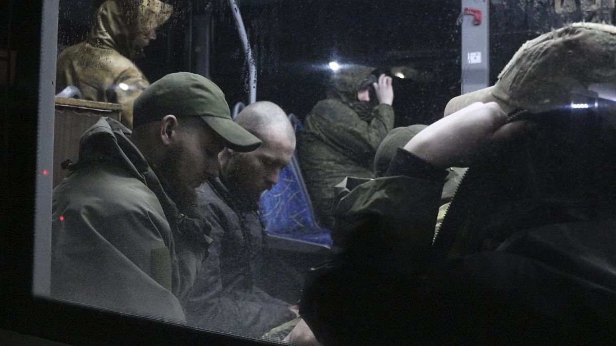 Ukrainian servicemen in a bus after leaving Mariupol's Azovstal steel plant, near a penal colony in Olyonivka, in Donetsk People's Republic territory, Ukraine, May 20, 2022.