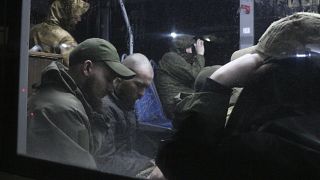 Ukrainian servicemen in a bus after leaving Mariupol's Azovstal steel plant, near a penal colony in Olyonivka, in Donetsk People's Republic territory, Ukraine, May 20, 2022.