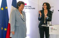 French Culture Minister Roselyne Bachelot, left, smiles as newly named French Culture Minister Rima Abdul-Malak